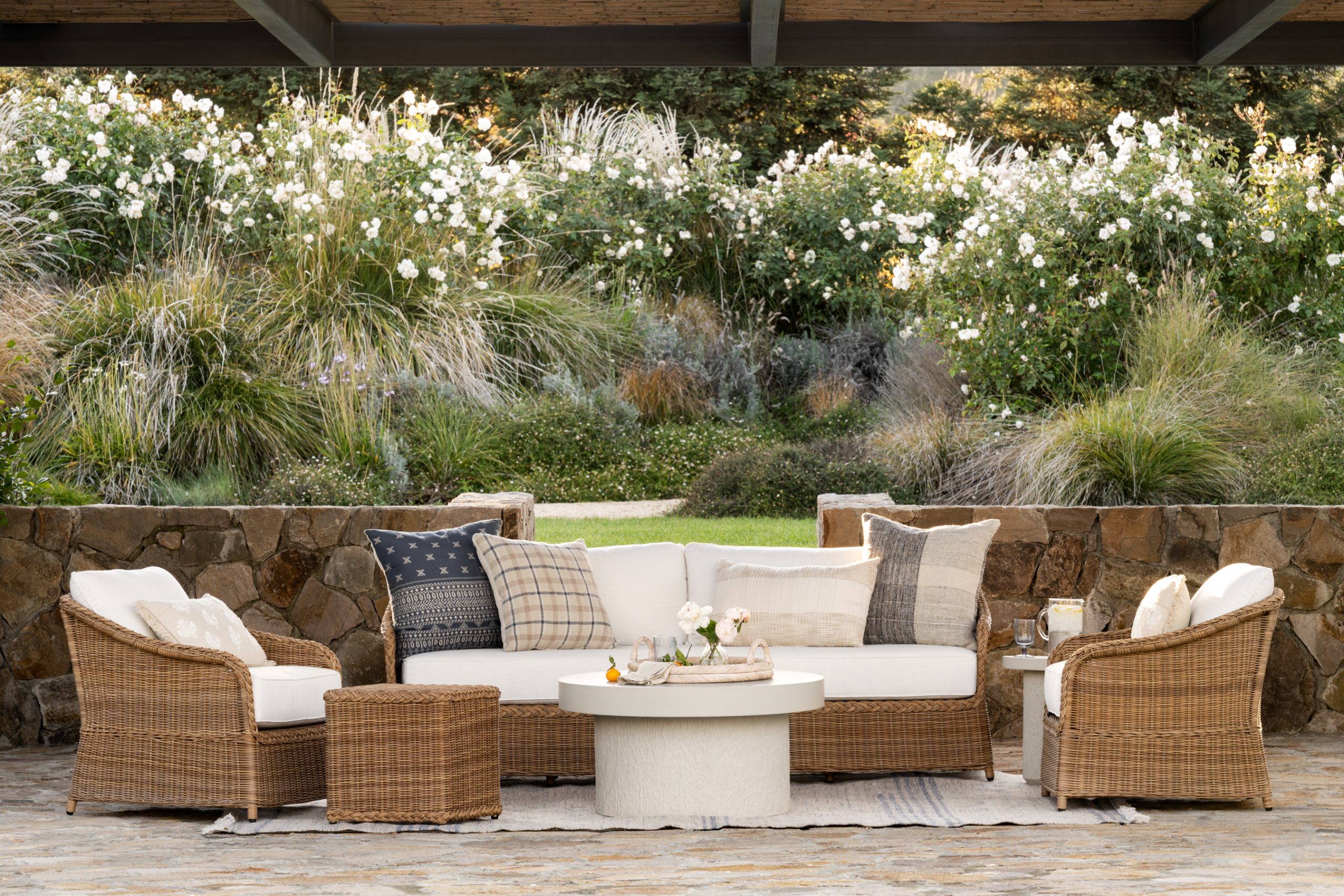 outdoor wicker lounge chairs and sofa around fiber stone coffee table