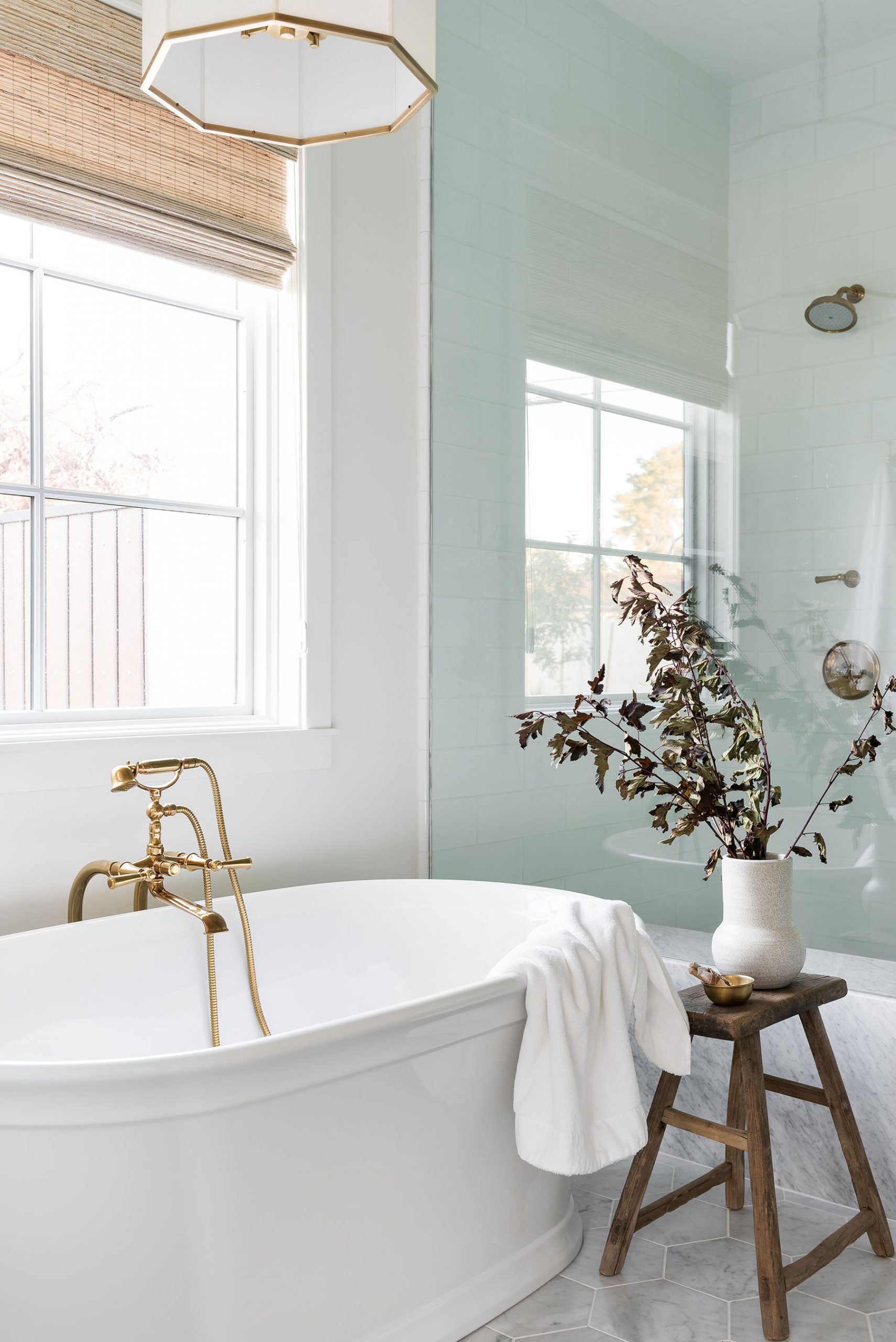 bathroom with white standing tub