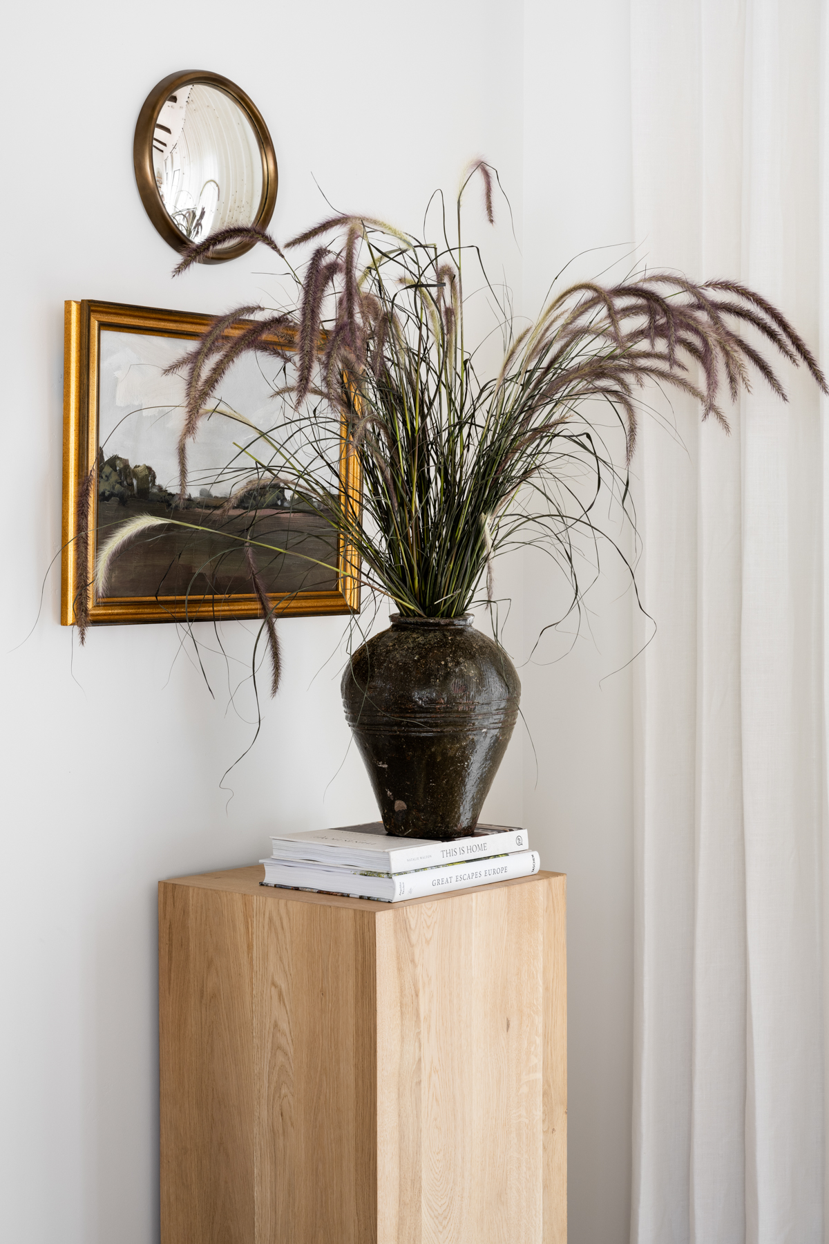 Wood pedestal in the corner of living room