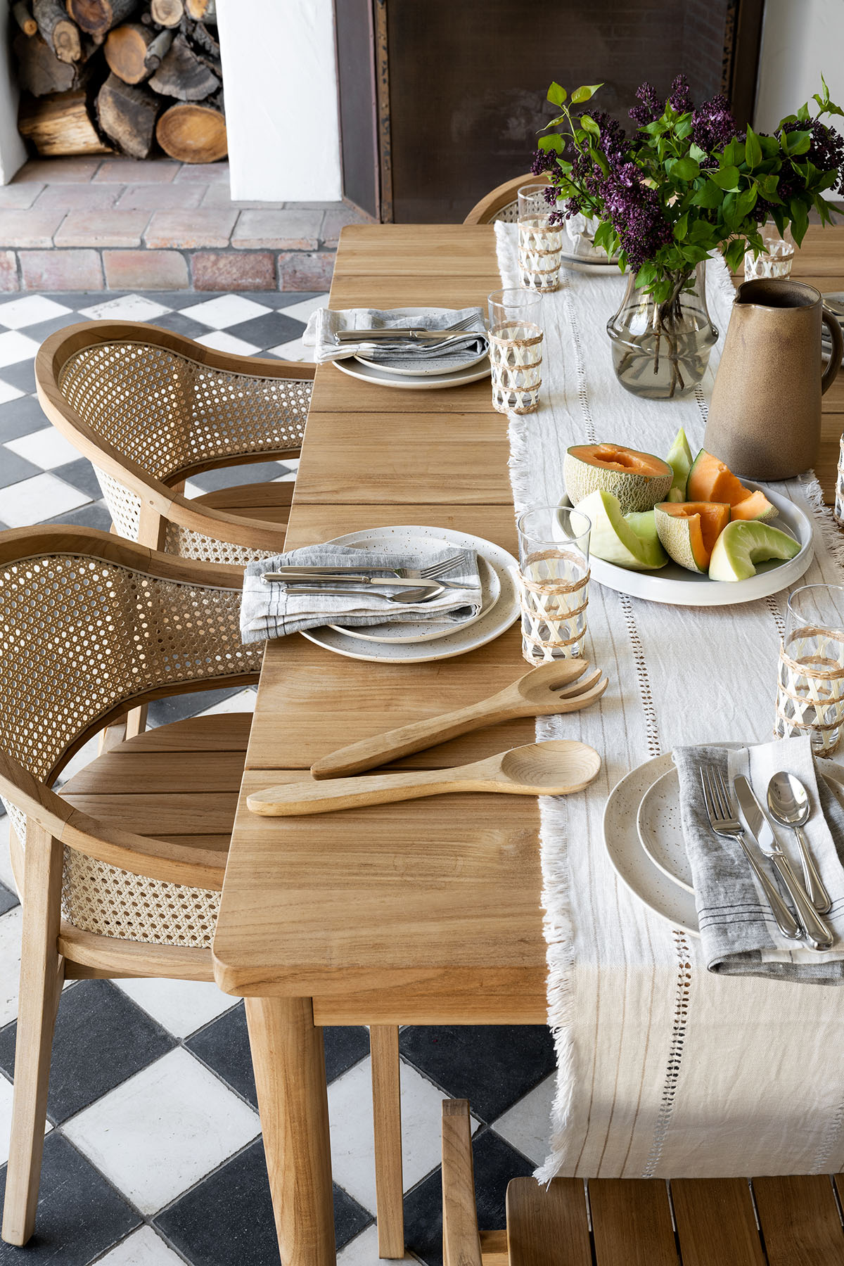 outdoor tablescape with seagrass wrapped glasses