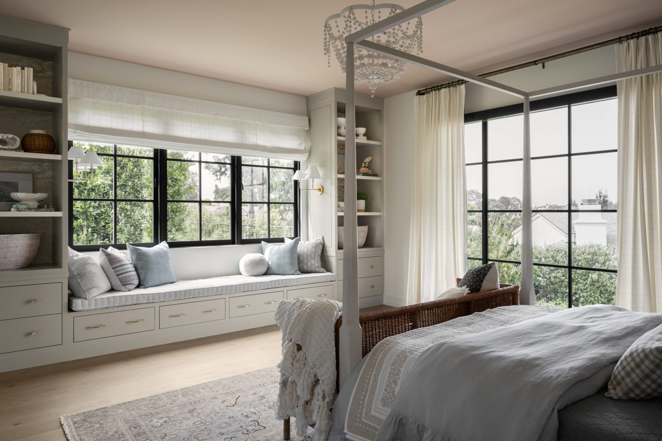 bedroom with built-in cabinets window seat and canopy bed