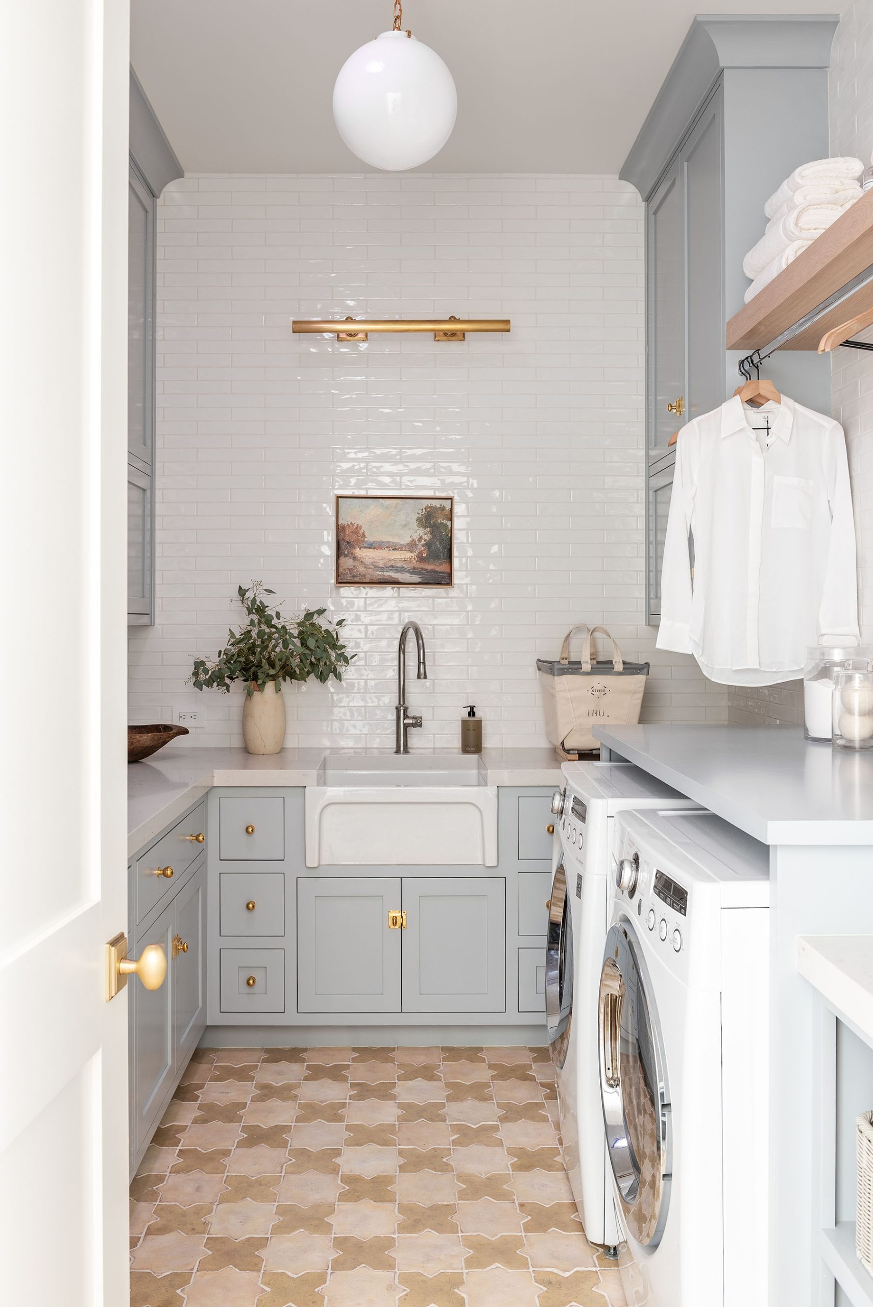 laundry room with blue cabinets