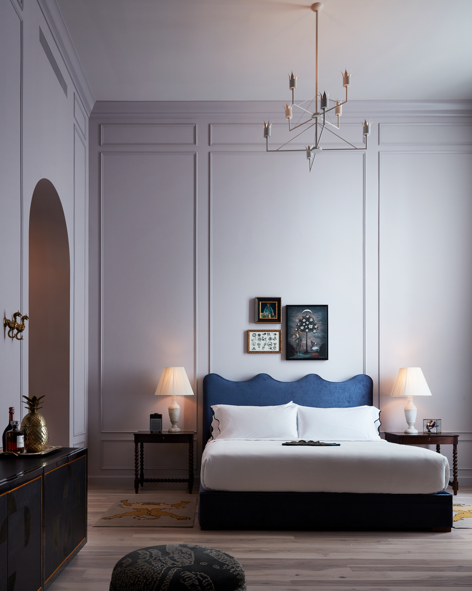 Maison de la Luz guest bedroom with blue curved headboard