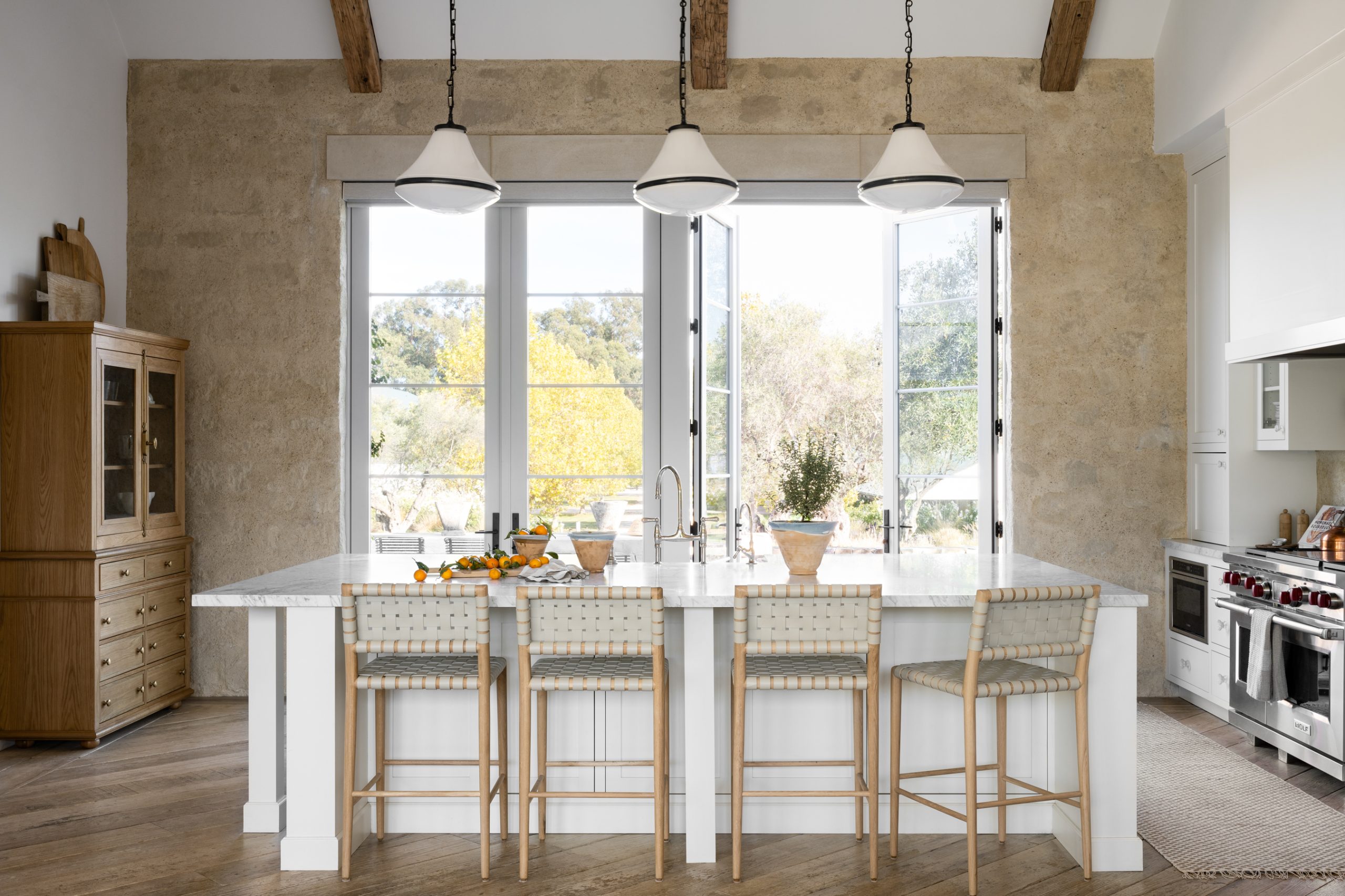 spring kitchen with gray leather stools