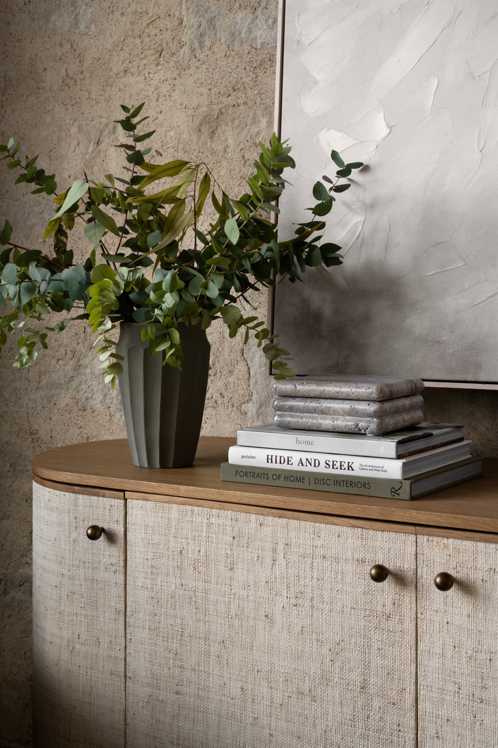 stone box stacked on books on console table