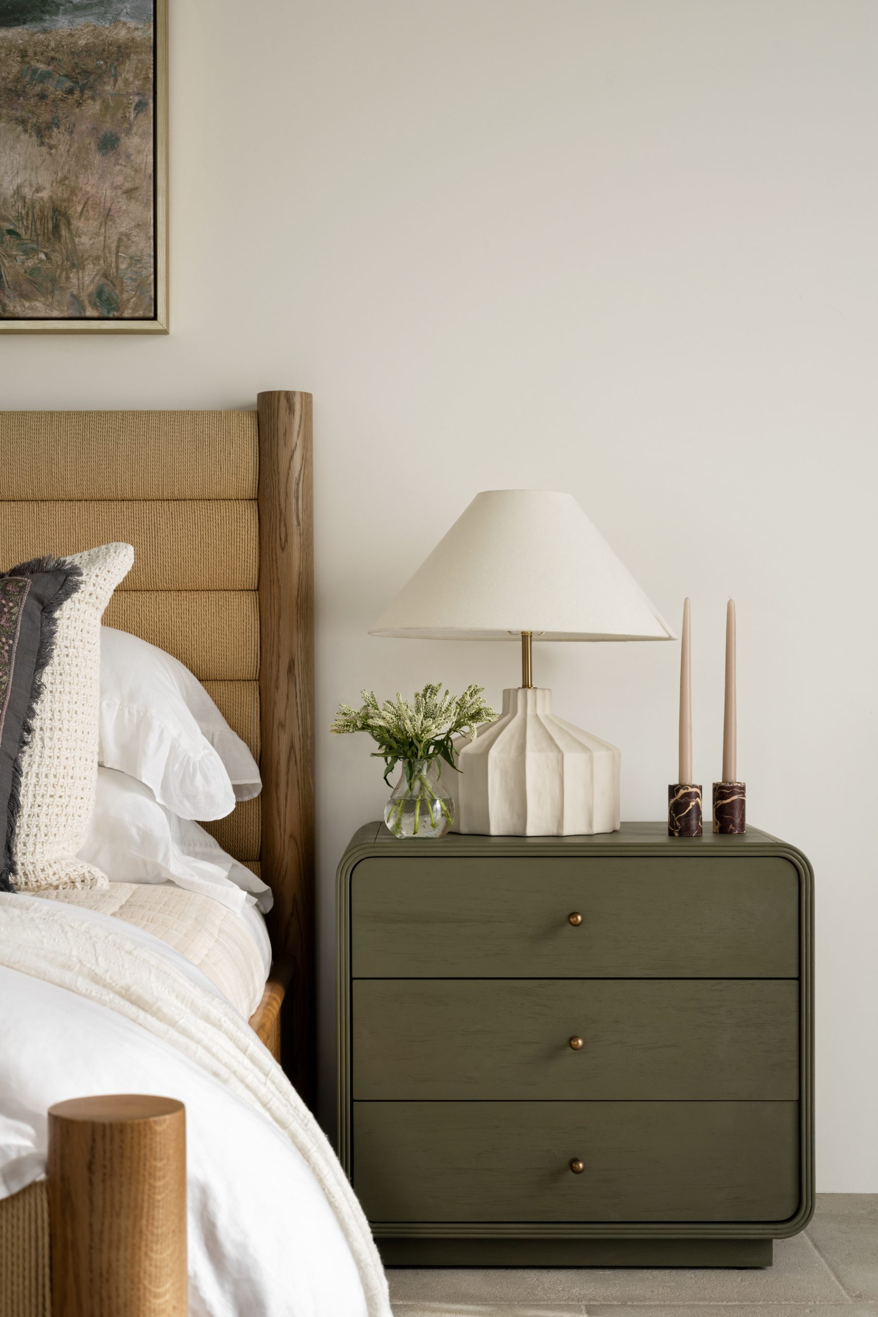 bedroom with bed and green nightstand