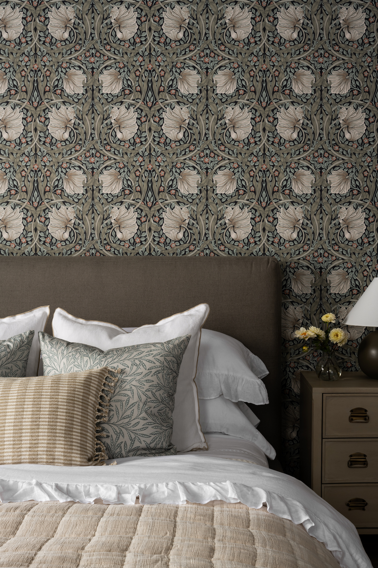 floral wallpaper with styled bed