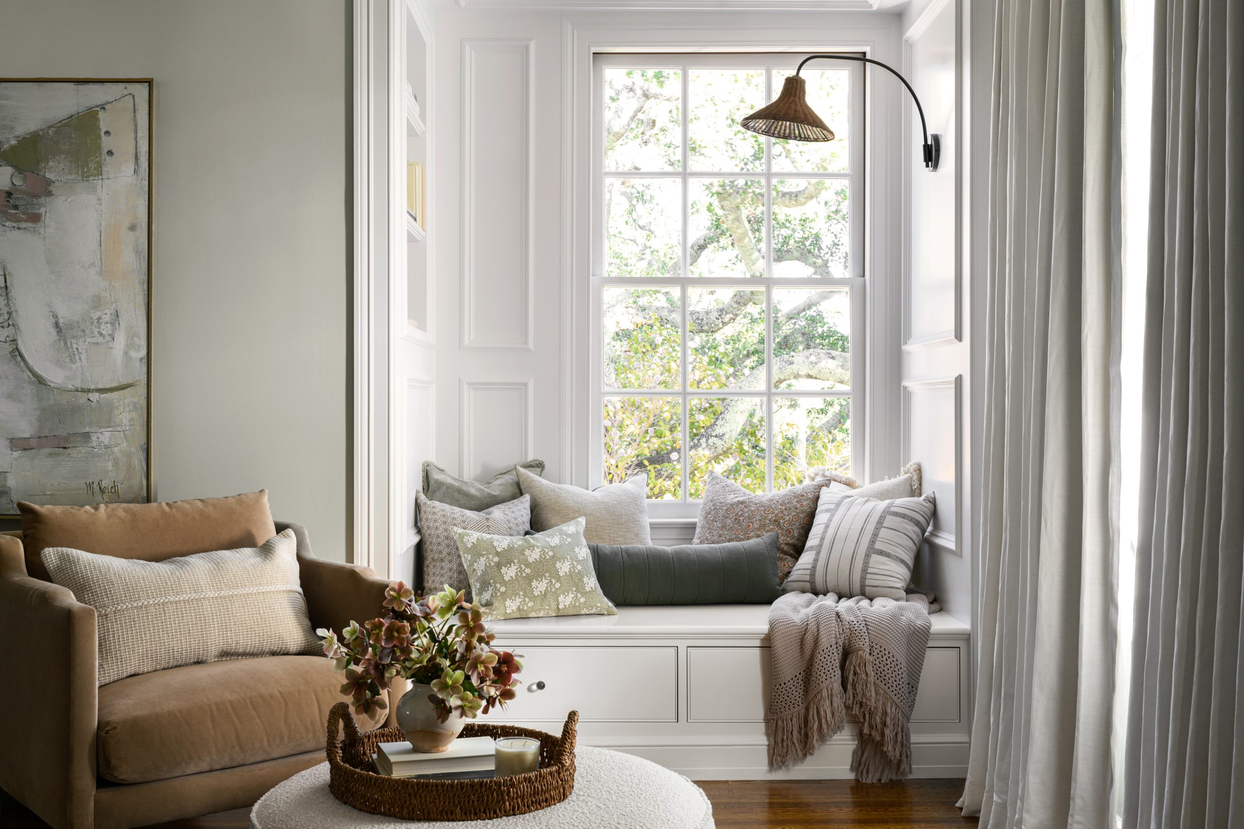 white wood window nook with green pillows