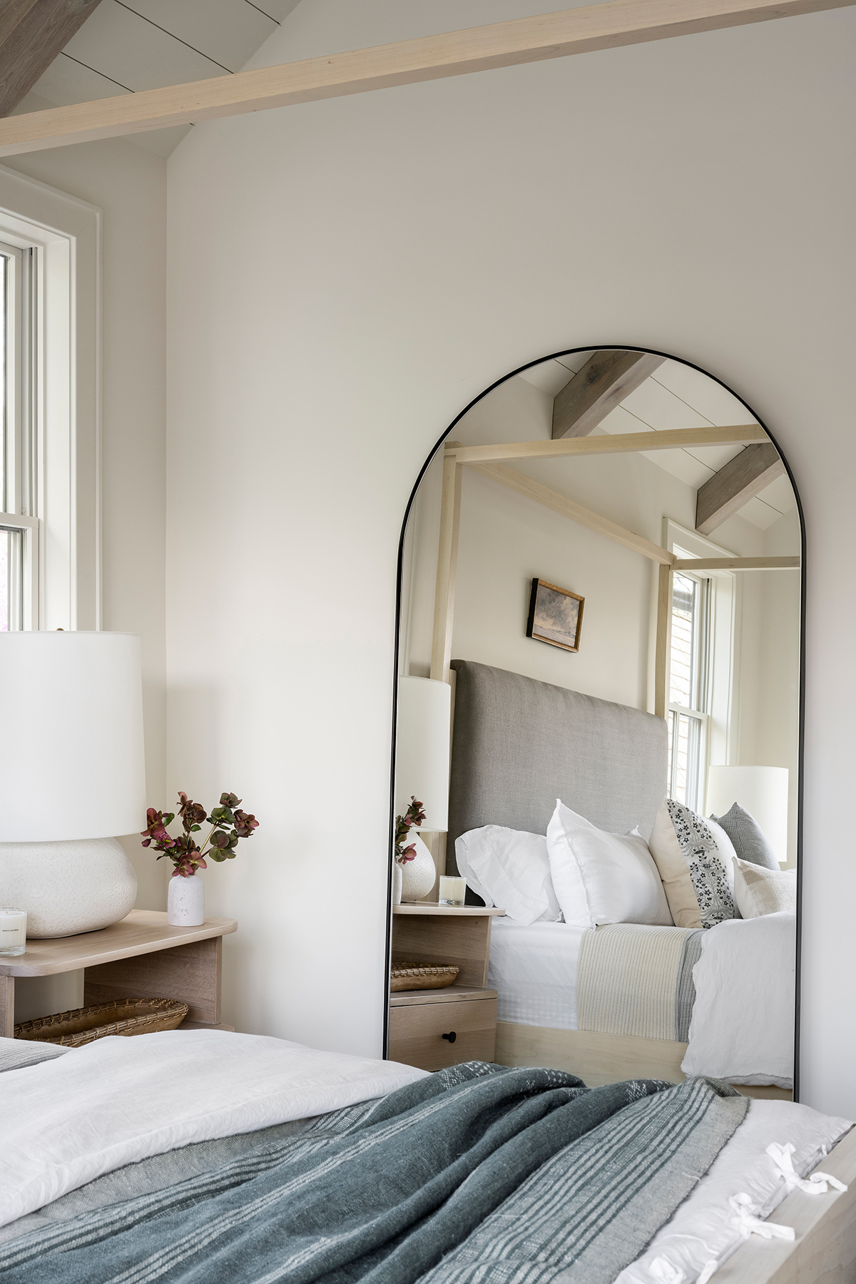 curved mirror in bedroom