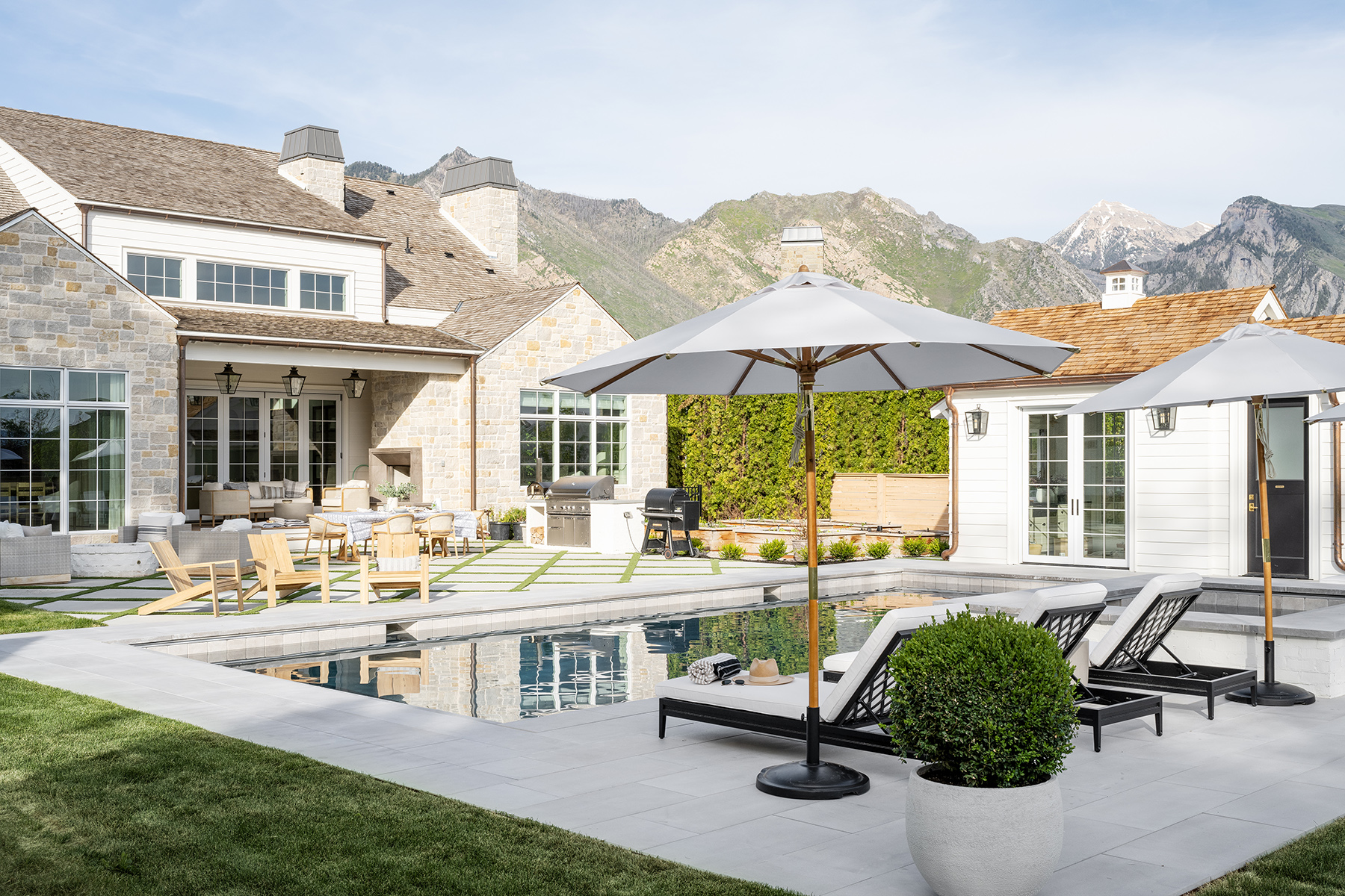 backyard with pool, grill, and outdoor dining area