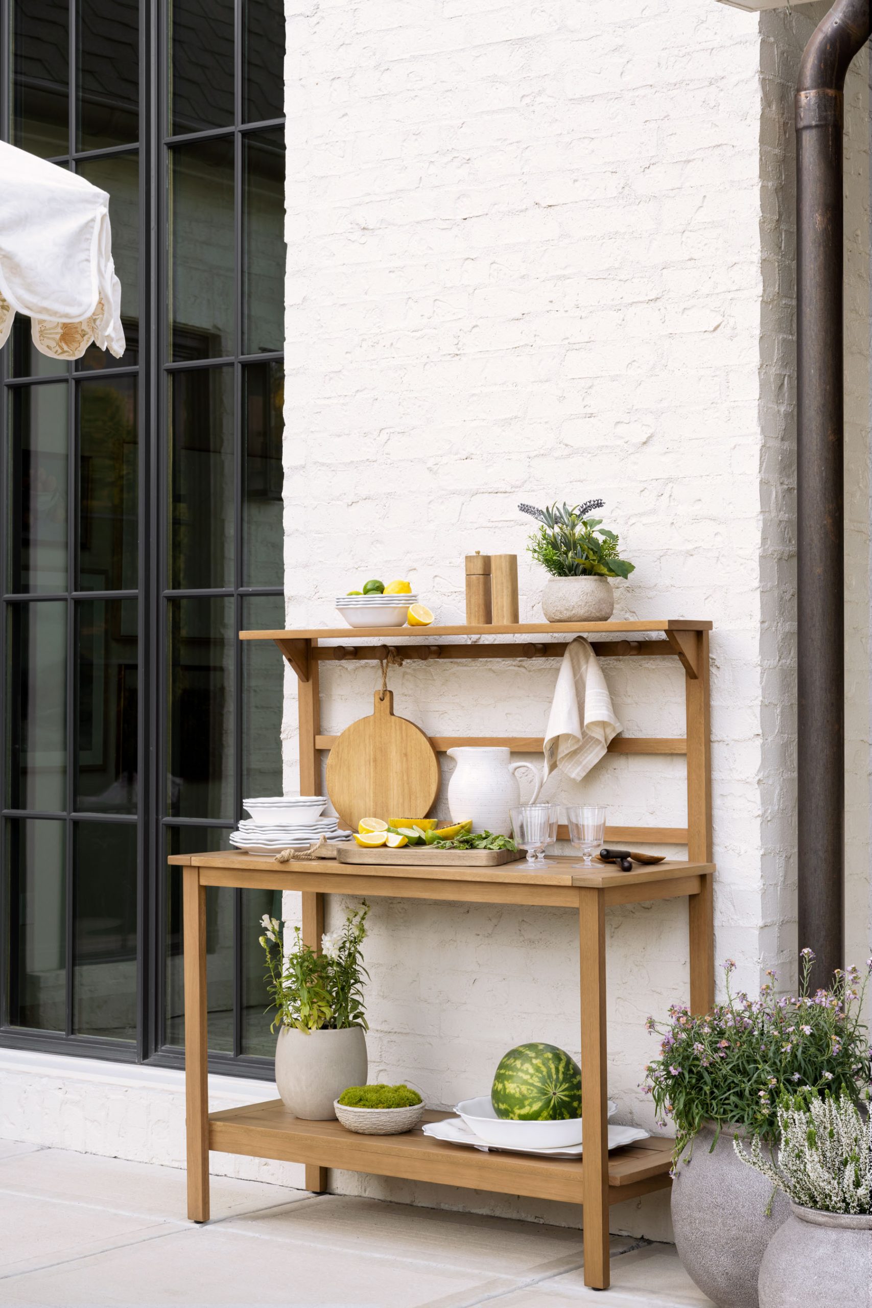 Wood hutch with outdoor dining essentials