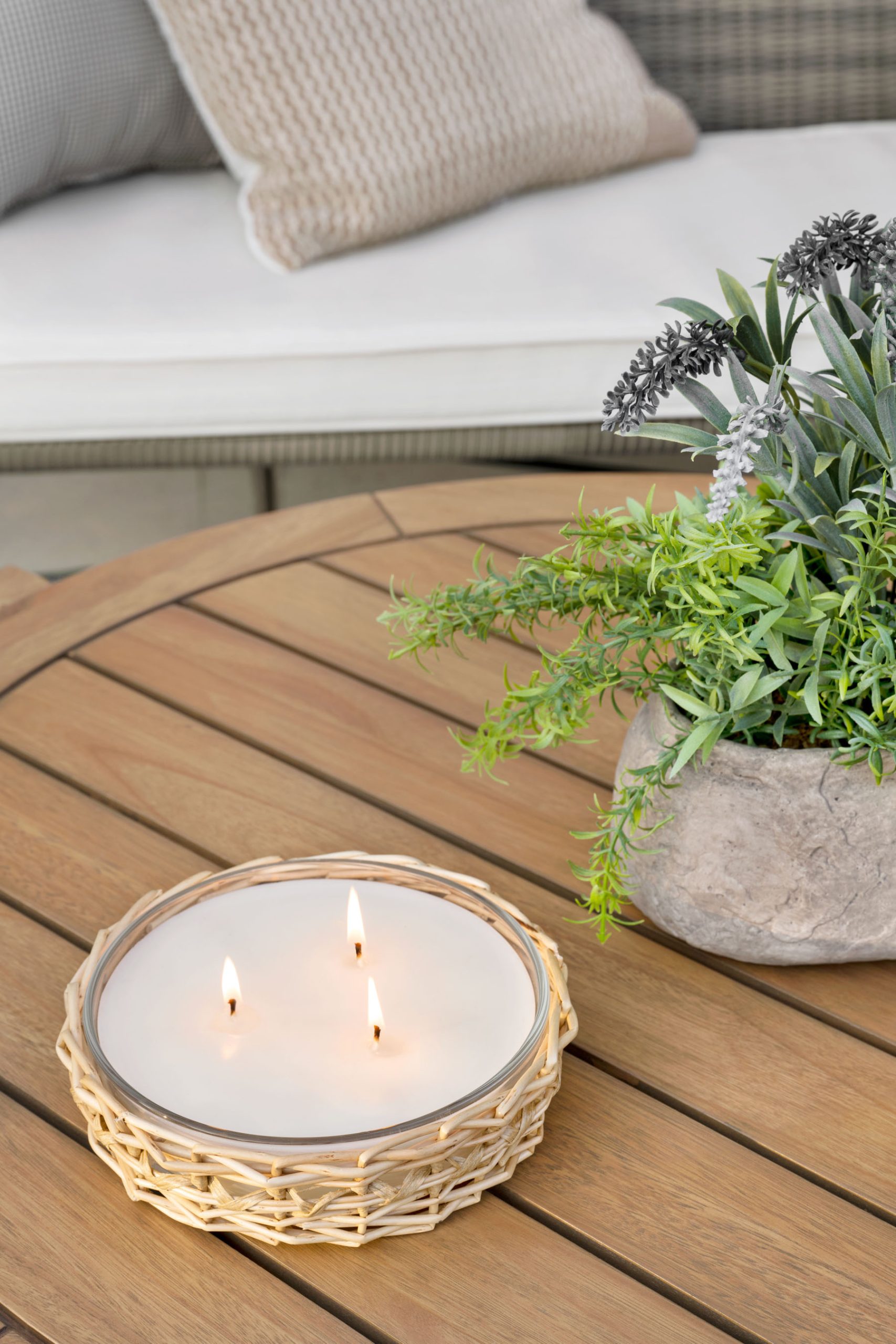 Wicker candle with round coffee table
