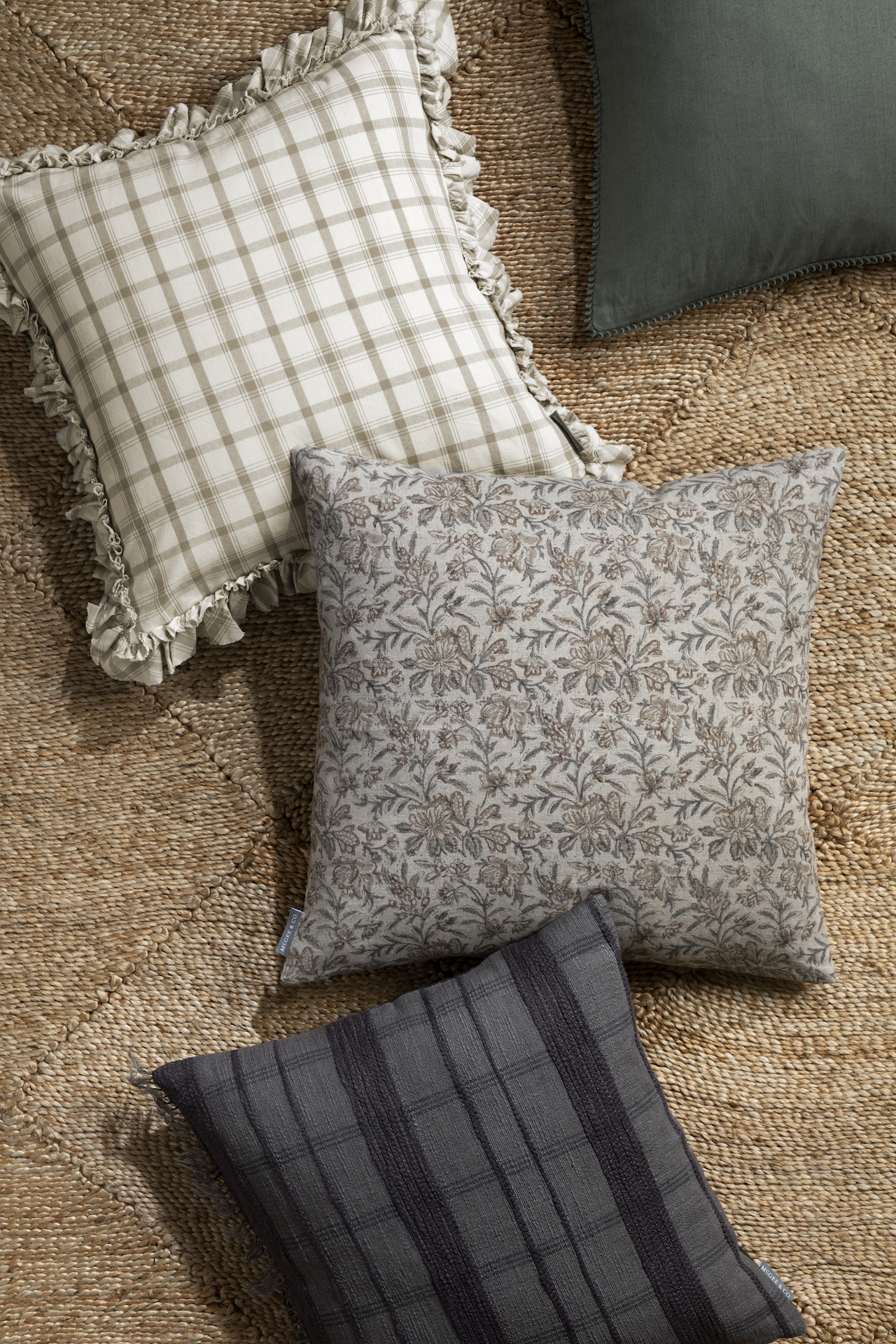 Patterned throw pillows on jute rug