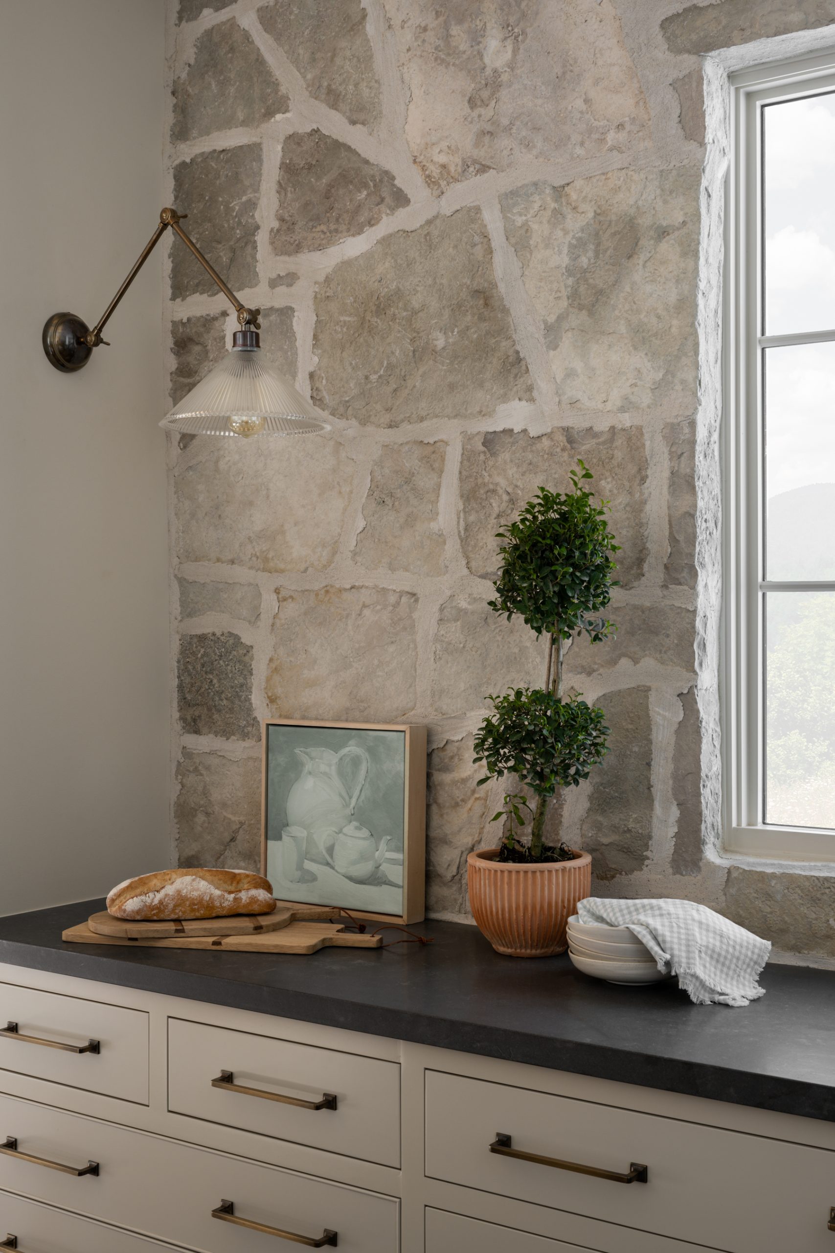 kitchen with stone wall