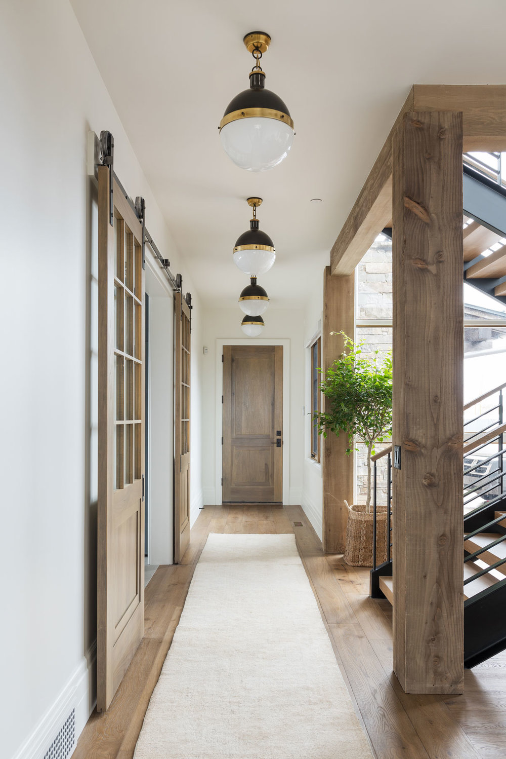 hallway with natural wood beams