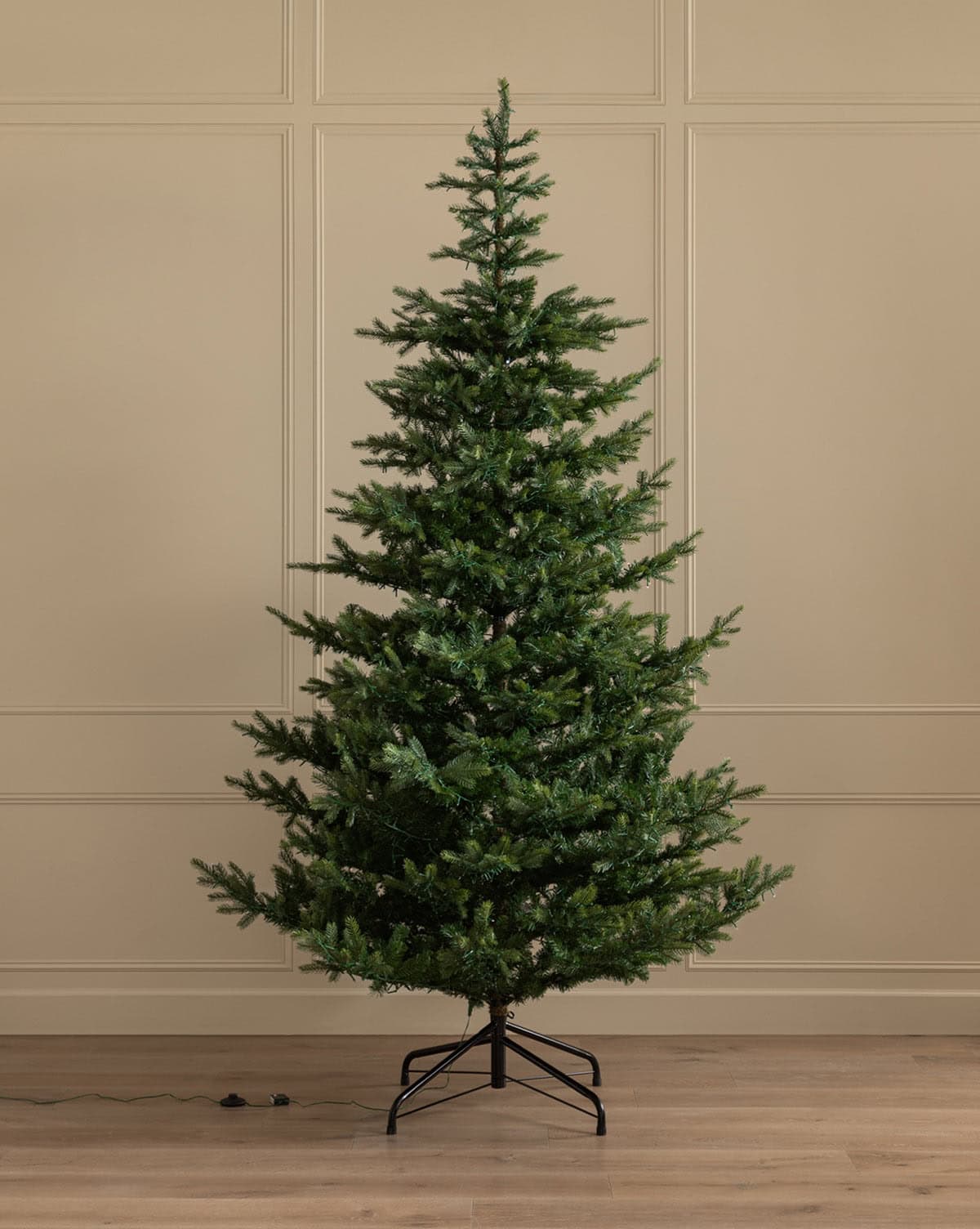 Decorate with a floor to ceiling 9' faux pre-lit fir tree from Studio McGee.