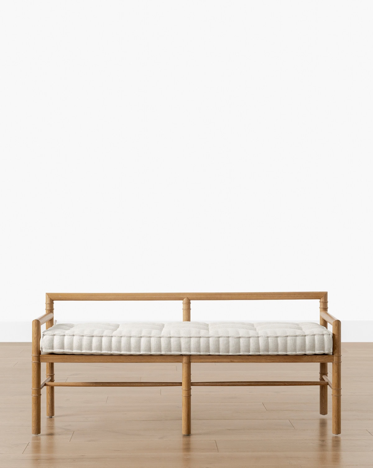 The Hindley bench designed with spindle-framed wood and a comfortable 1-bench cushion perfect for home entryways seen on Studio McGee.