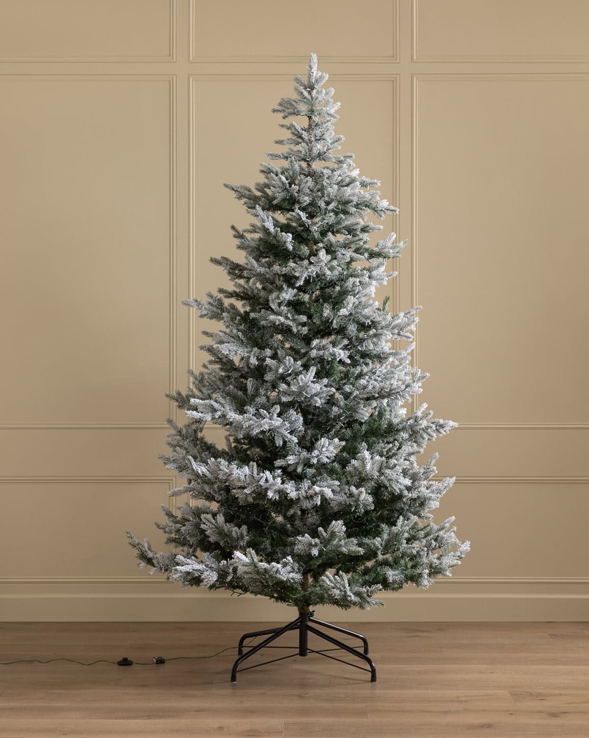 Beautiful snowy, pre-lit faux Christmas tree, the Grandis tree brings warmth and whimsy to your holiday home space from Studio McGee.
