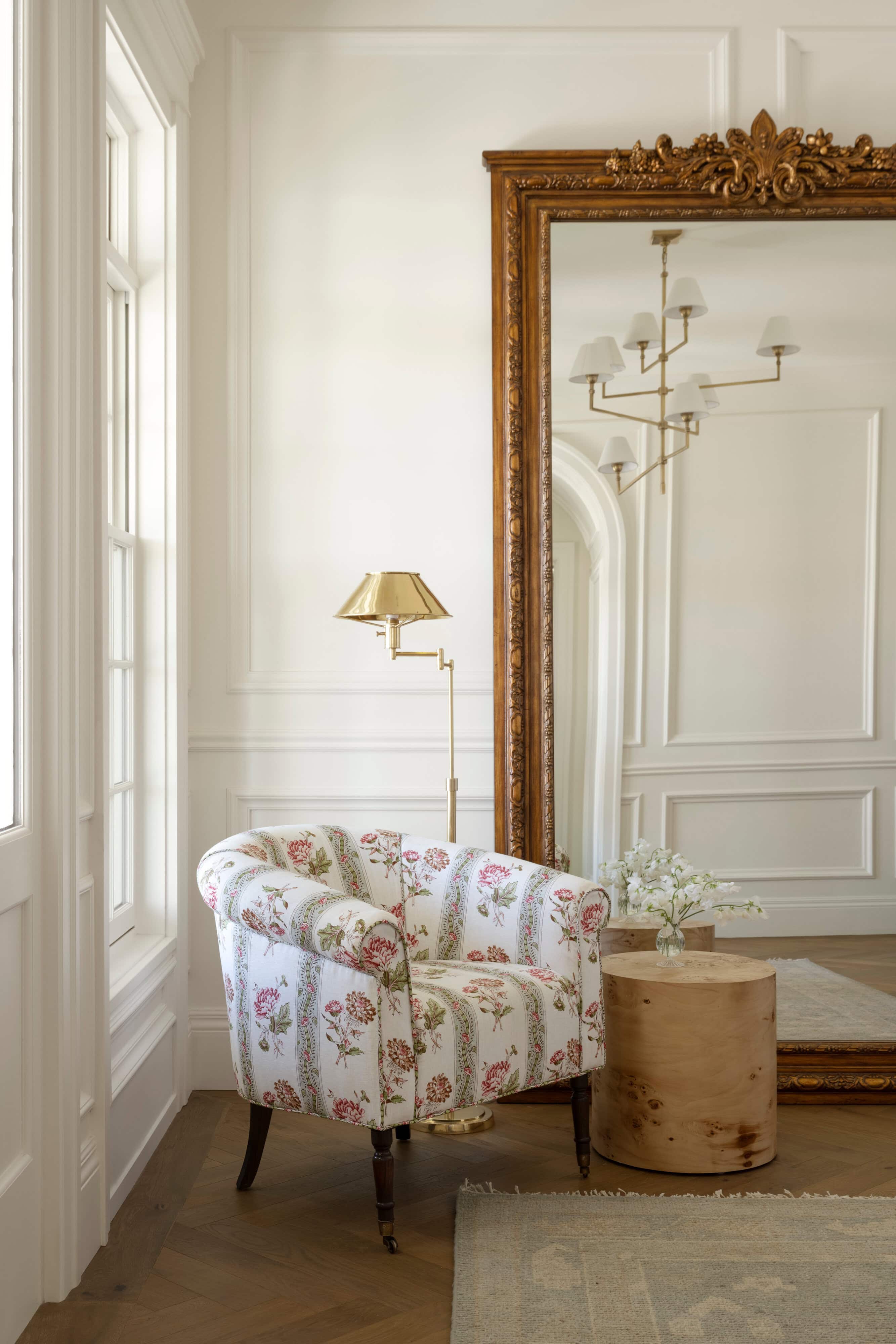 A chair next to a mirror, by McGee & Co.