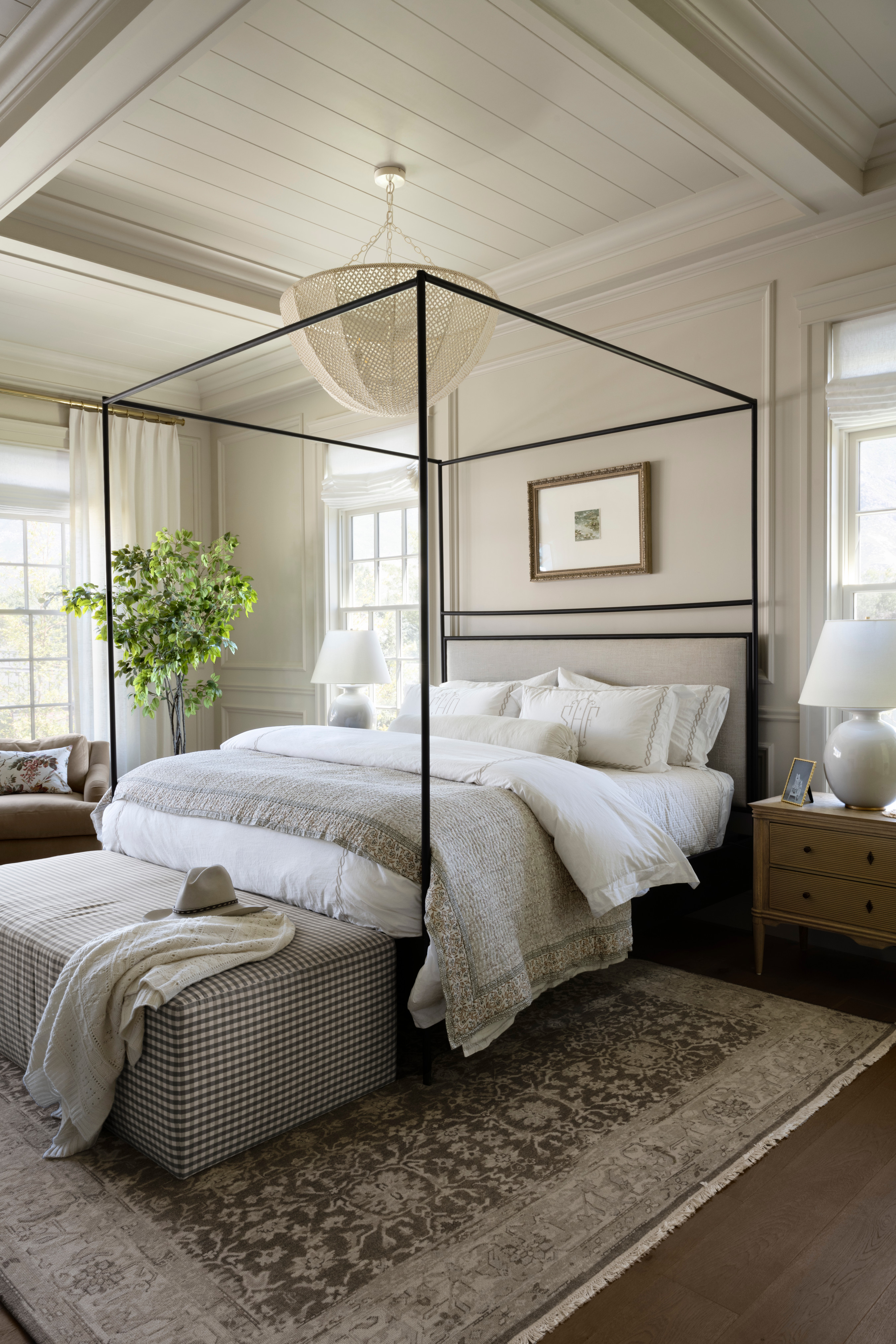 A bed with a metal frame, by McGee & Co.