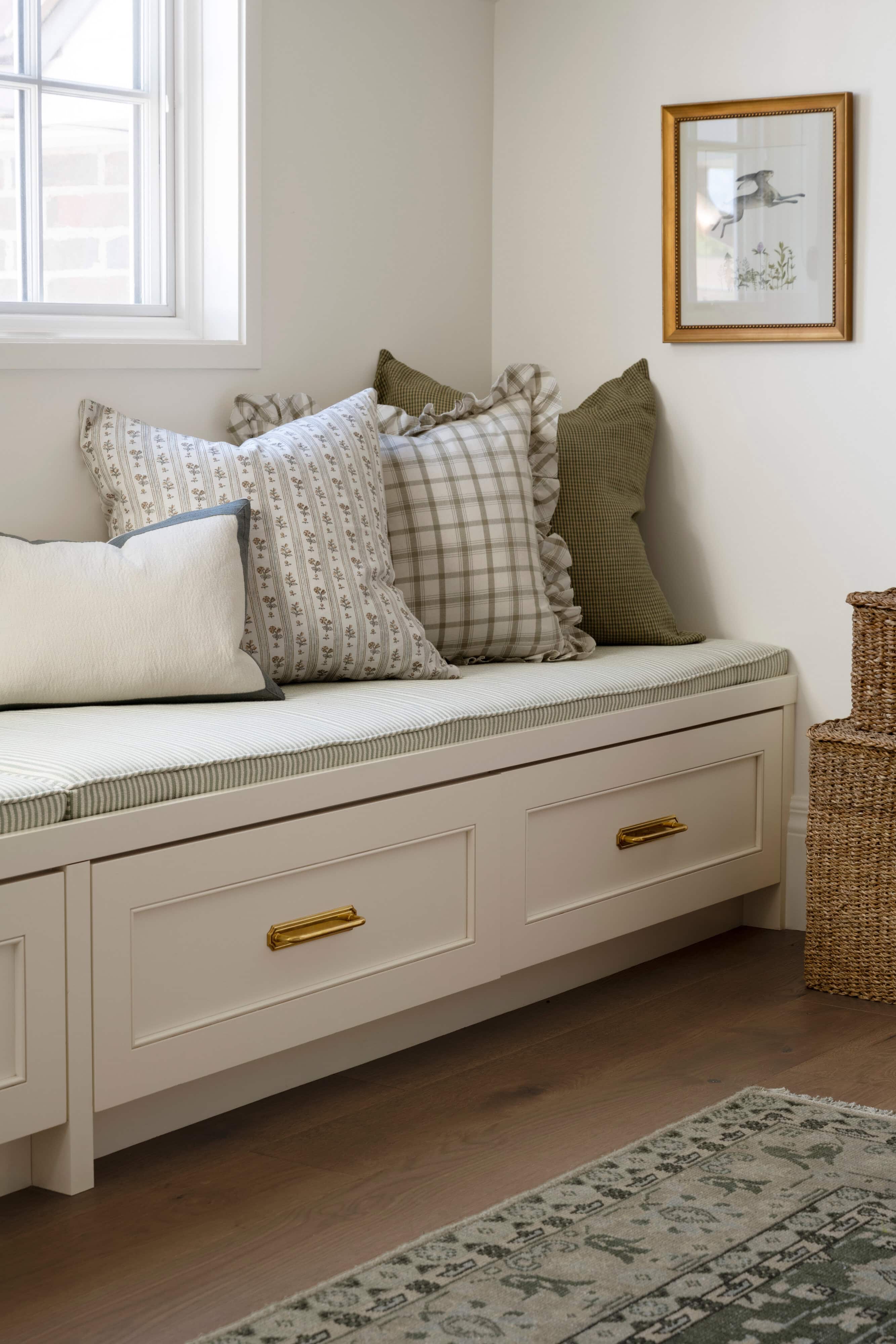 A bench with pillows on it, by McGee & Co.