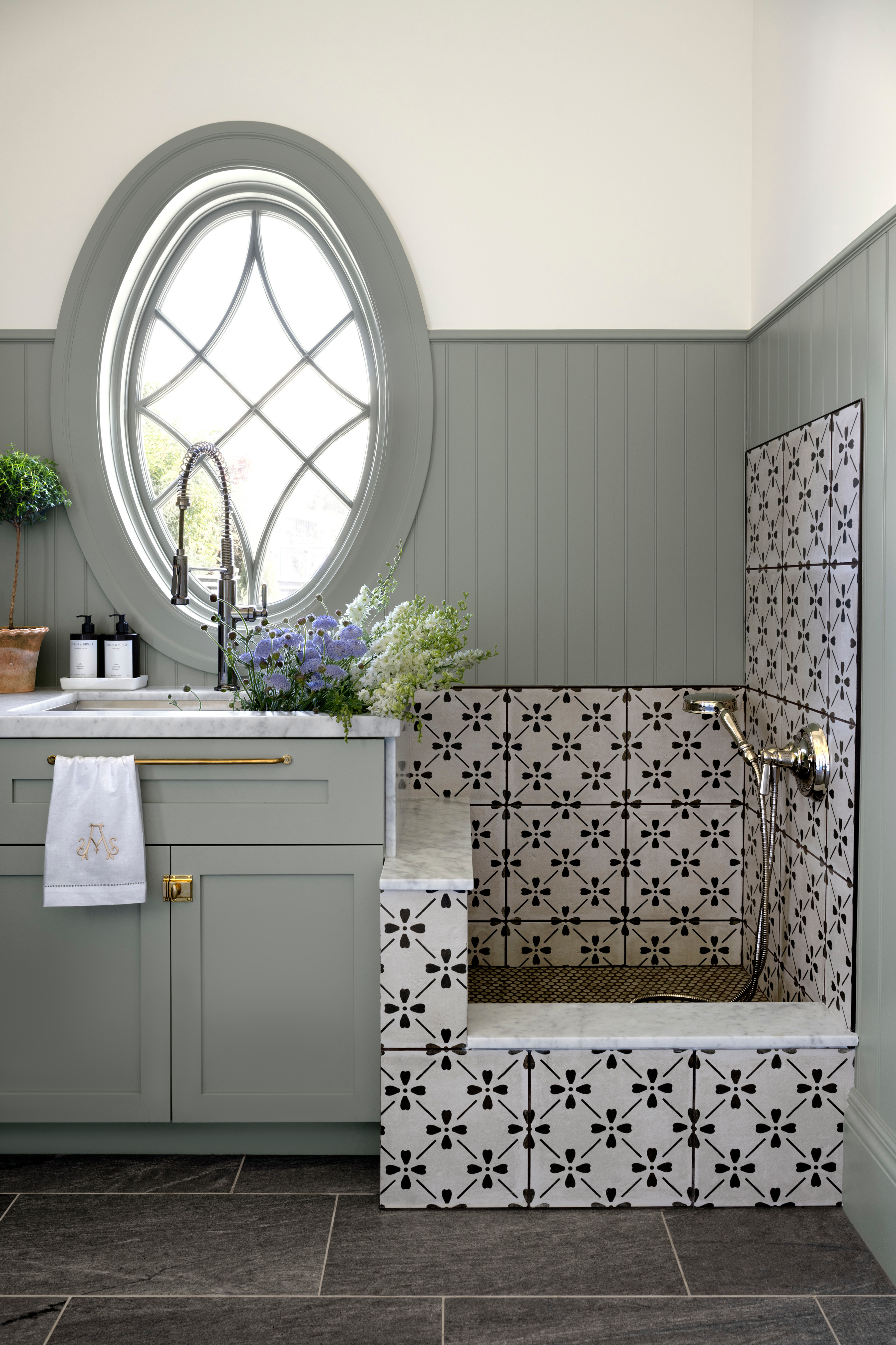 A bathroom with a sink and a window, by McGee & Co.