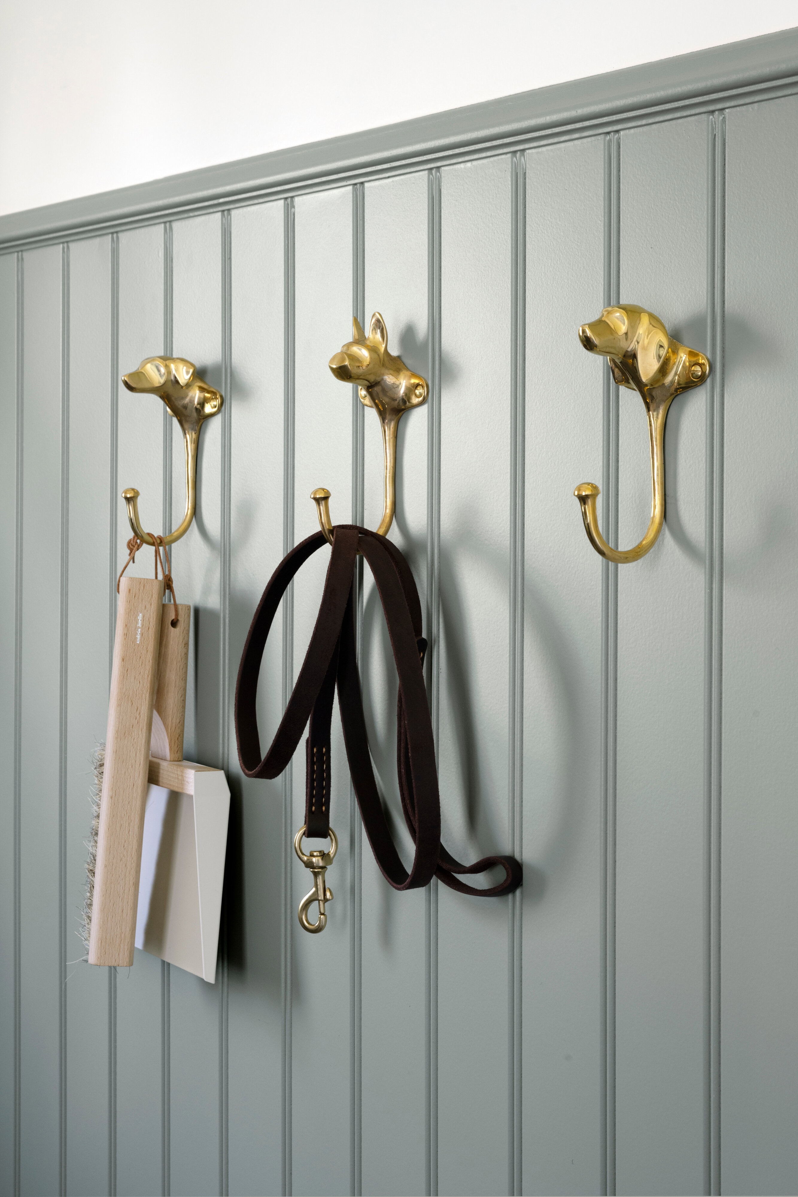 A dog leash and leash on a wall, by McGee & Co.