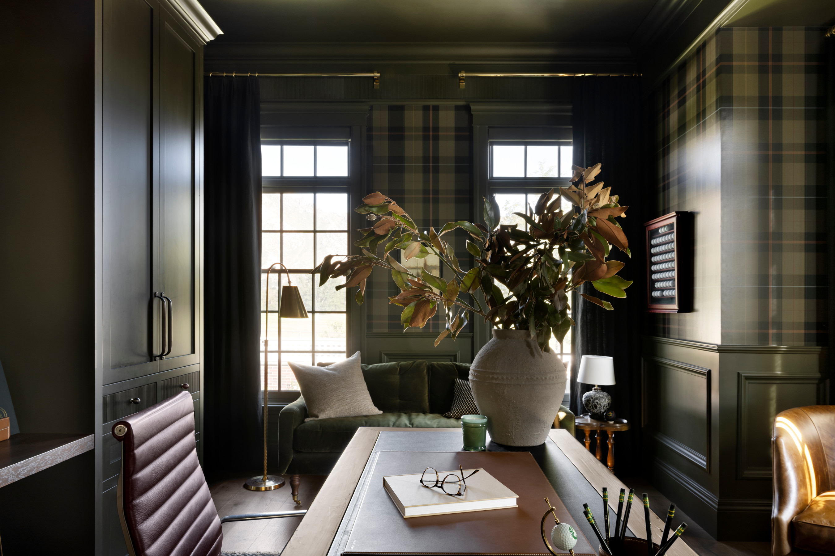 A room with a table and a plant in it, by McGee & Co.