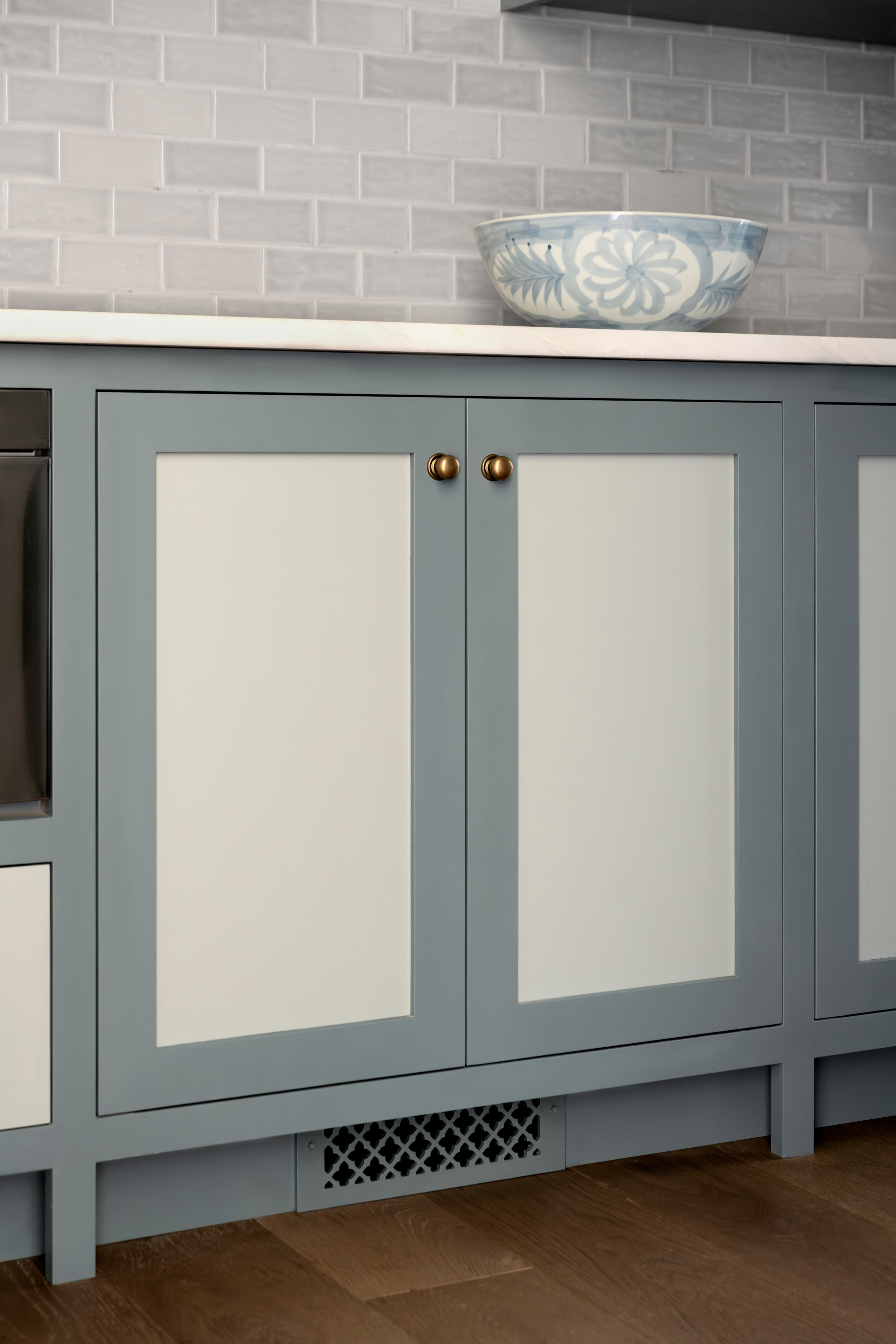 A blue and white bowl on a counter top, by McGee & Co.