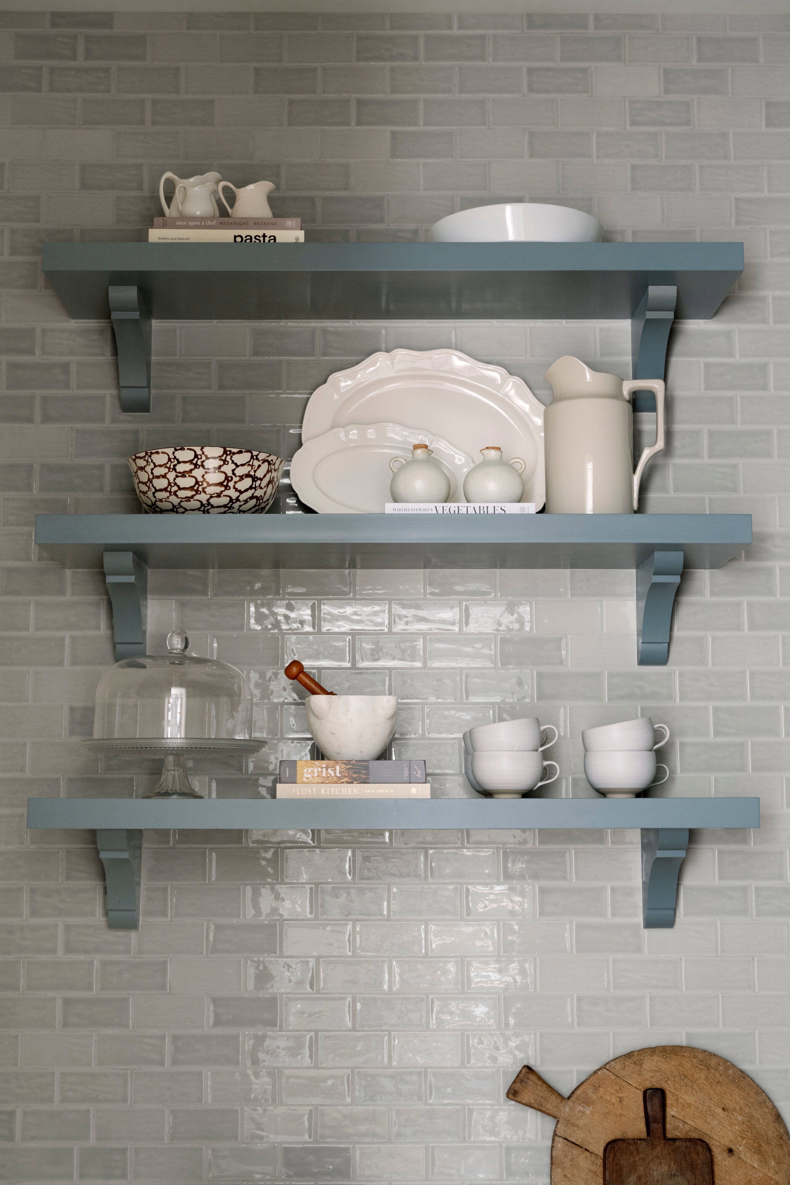 A shelf with plates and bowls on it, by McGee & Co.