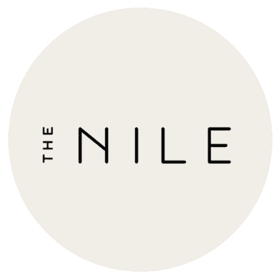 Black text reads THE NILE, with THE written vertically to the left of NILE, centered on a light beige circular background by McGee & Co.