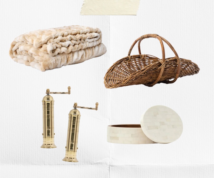 A collage of home decor items on a white background: a folded beige faux fur throw, a woven wicker basket, a pair of brass pepper and salt mills, and a round white mosaic box with a lid, by McGee & Co.