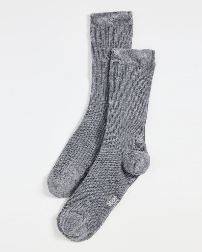 Two gray ribbed crew socks laid flat on a white surface, slightly overlapping each other, with the toes pointing to the lower left, by McGee & Co.